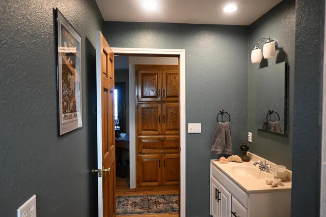 a bathroom with a sink and a mirror