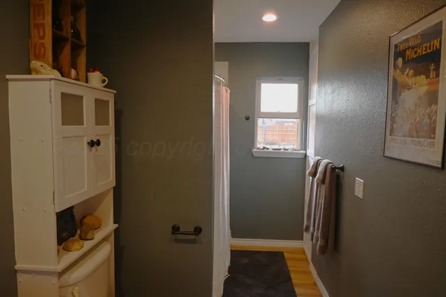 a view of hallway with windows