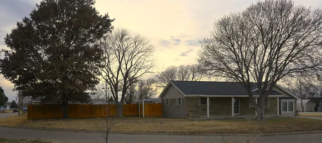 front view of a house with a trees