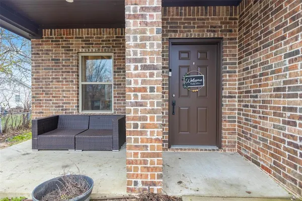 a view of front door of house with couch