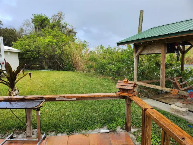 a view of a garden with a house