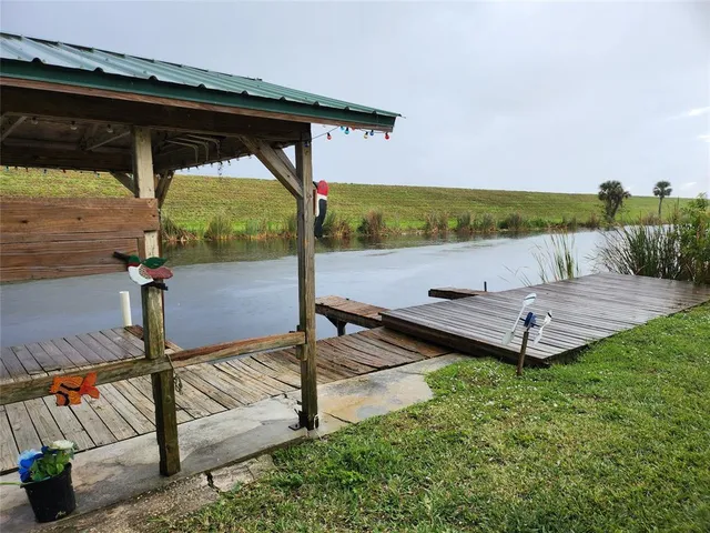 a view of a deck with couches and wooden floor