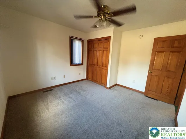 a view of a hallway with a chandelier