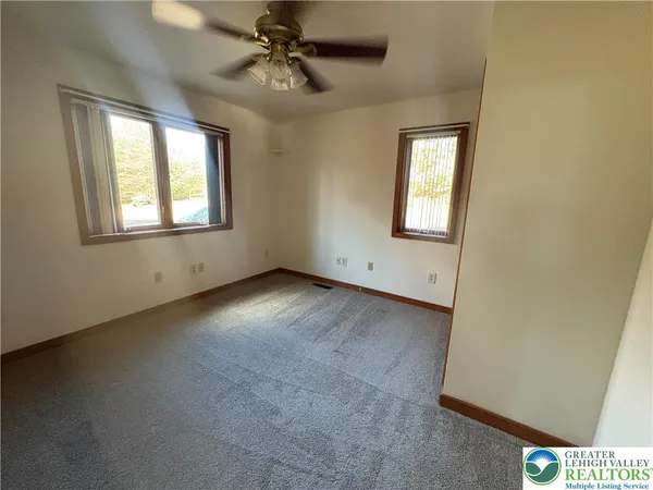 a view of an empty room with a window