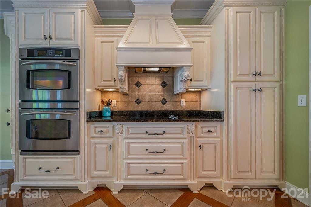 120 Pleasant Hill Road Landrum, SC 29356 - Photo 13 of 25 a stove top oven sitting inside of a kitchen