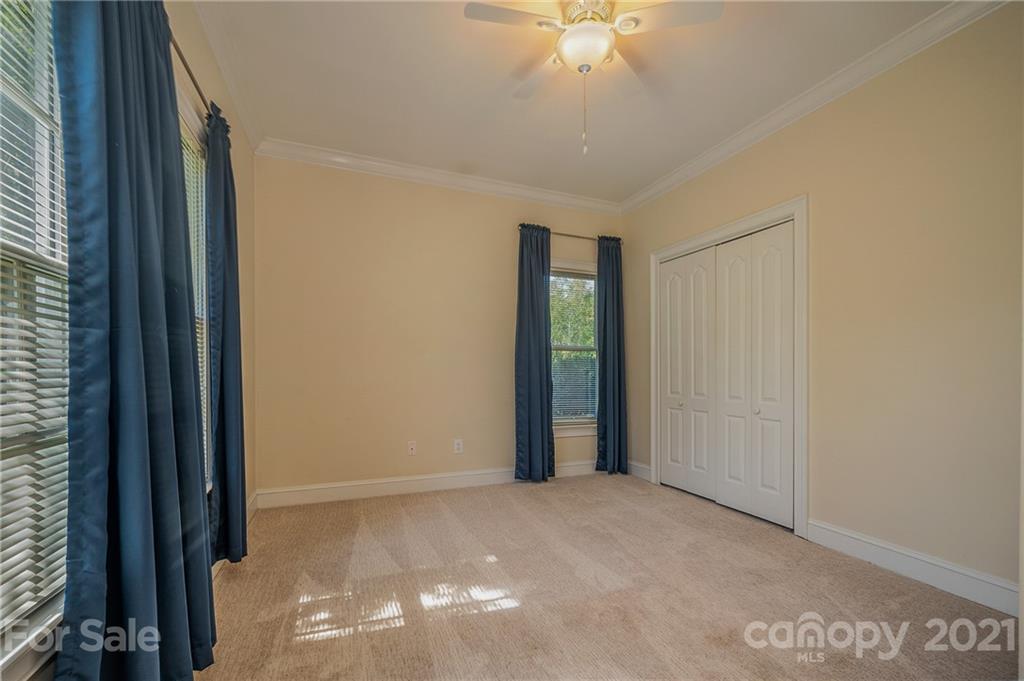 120 Pleasant Hill Road Landrum, SC 29356 - Photo 20 of 25 a view of a livingroom with a ceiling fan and window