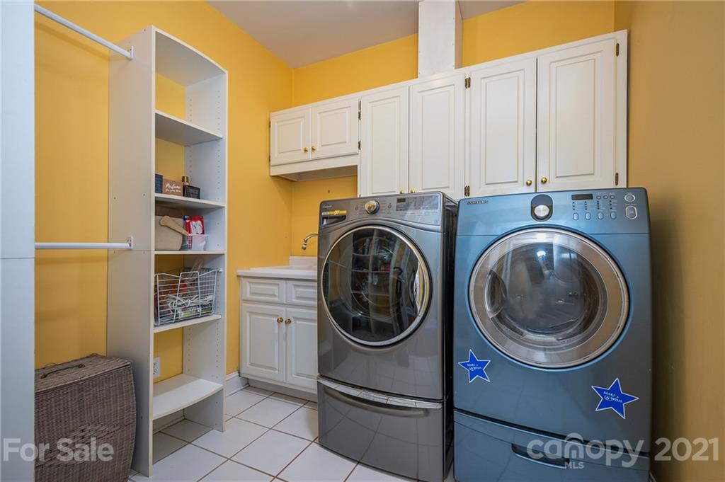 120 Pleasant Hill Road Landrum, SC 29356 - Photo 21 of 25 a utility room with stainless steel appliances washer and dryer