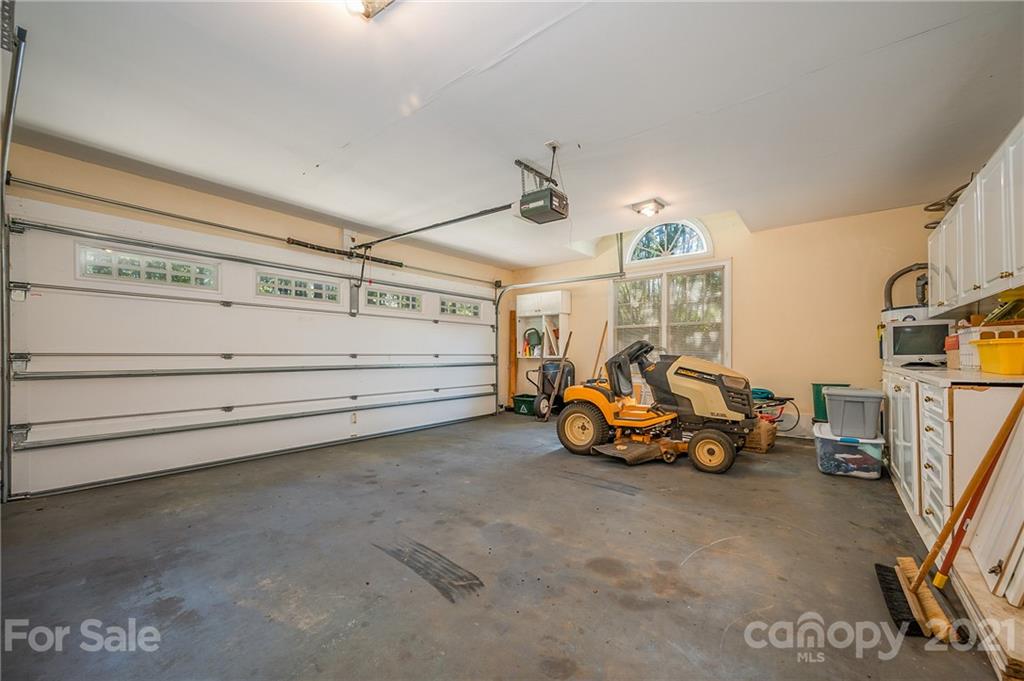 120 Pleasant Hill Road Landrum, SC 29356 - Photo 22 of 25 a view of a garage with parked cars