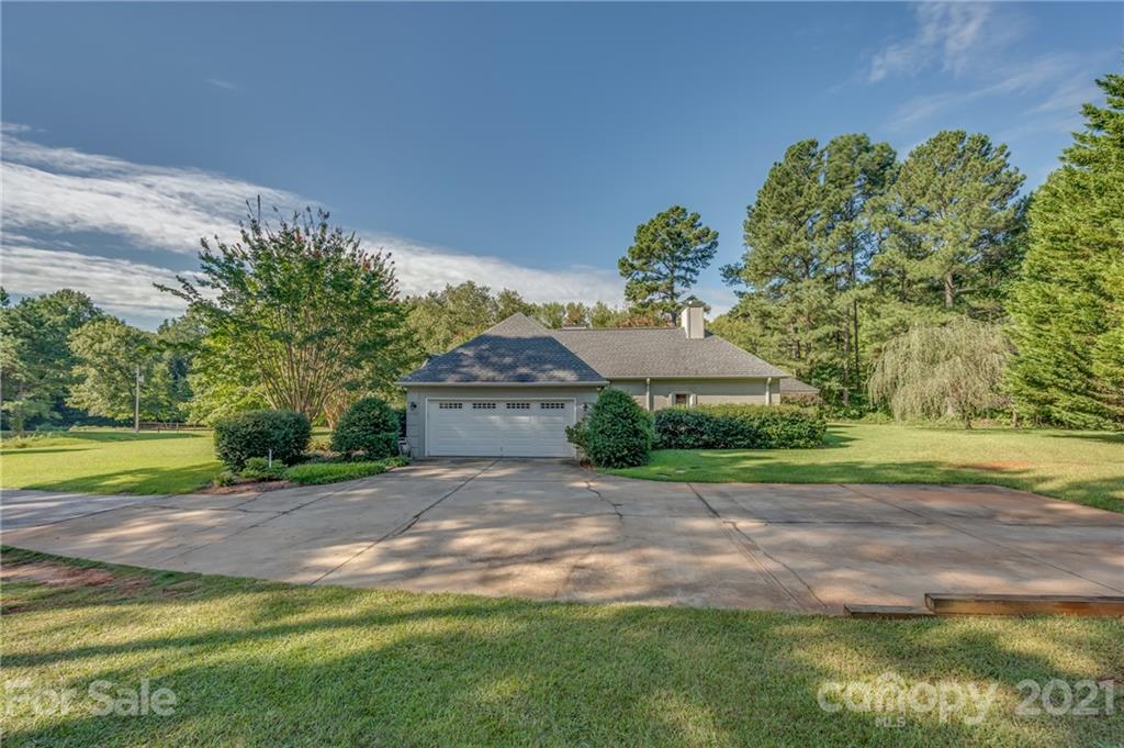 120 Pleasant Hill Road Landrum, SC 29356 - Photo 4 of 25 a front view of a house with garden