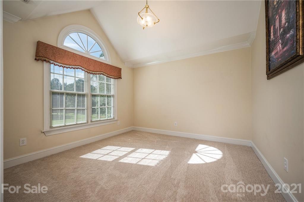120 Pleasant Hill Road Landrum, SC 29356 - Photo 9 of 25 an empty room with a window