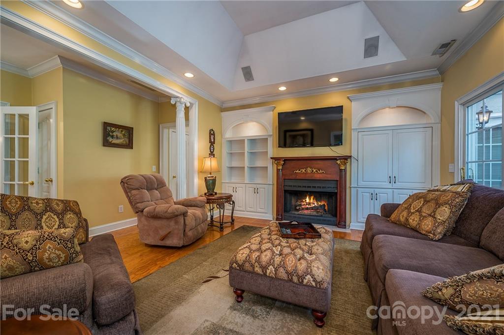 120 Pleasant Hill Road Landrum, SC 29356 - Photo 10 of 25 a living room with furniture a fireplace and a flat screen tv