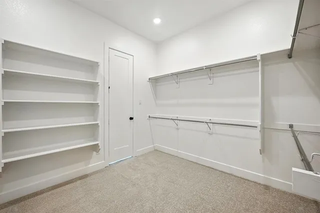 a view of an empty walk in closet