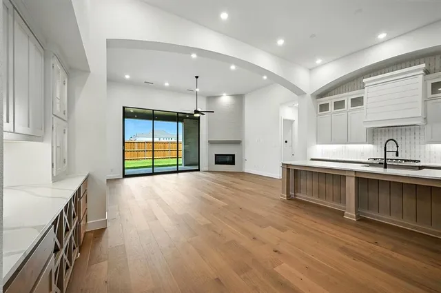 a kitchen with stainless steel appliances granite countertop a stove and a sink