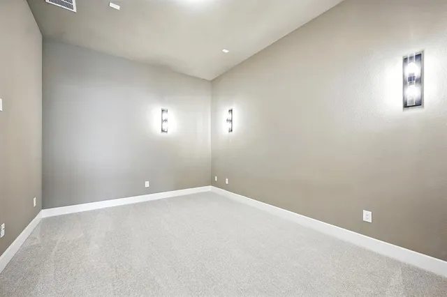 a view of a room with a big yard and potted plants
