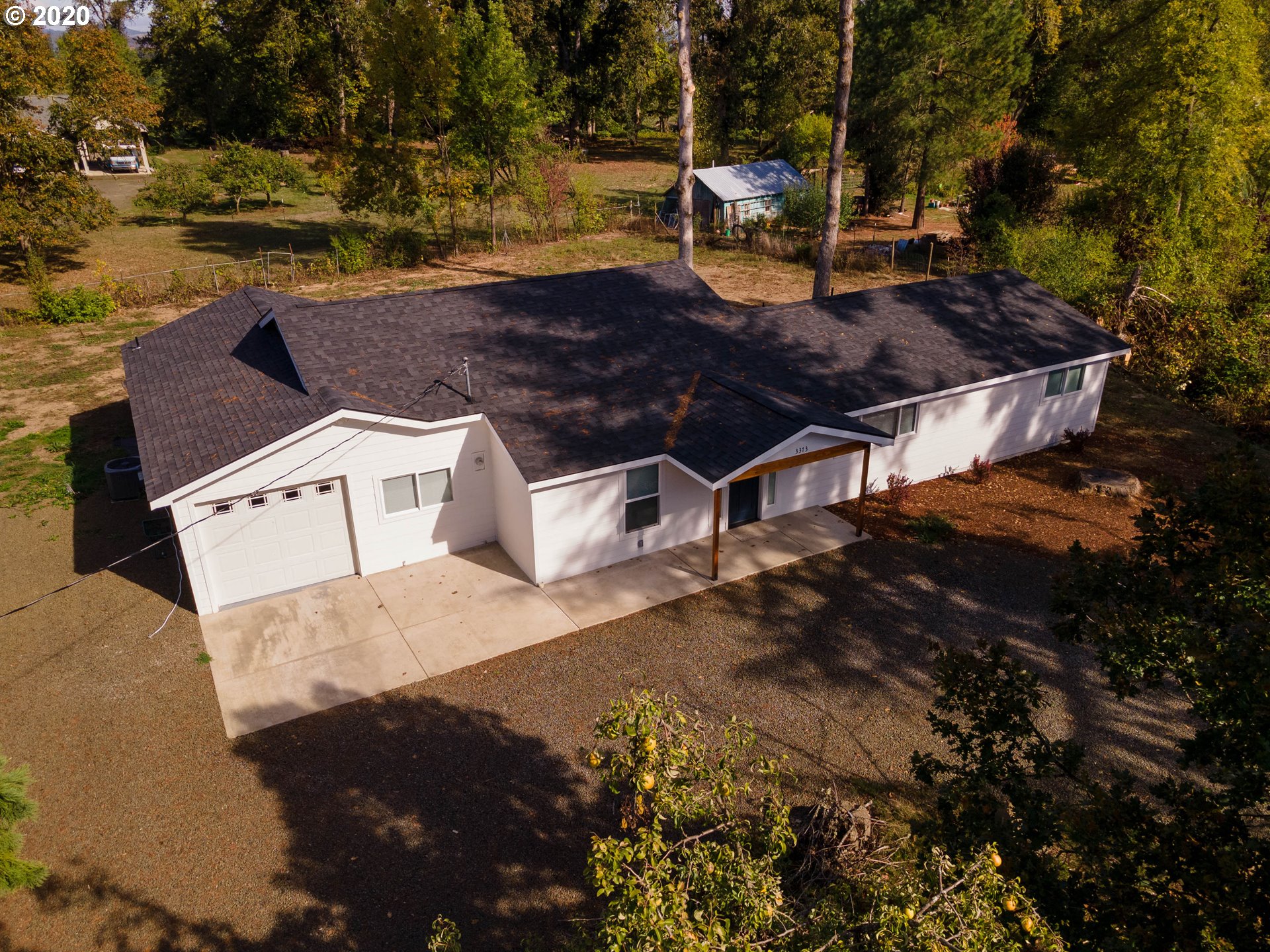3373 Melrose Road Roseburg, OR 97471 - Photo 1 of 32 a view of a backyard with sitting area
