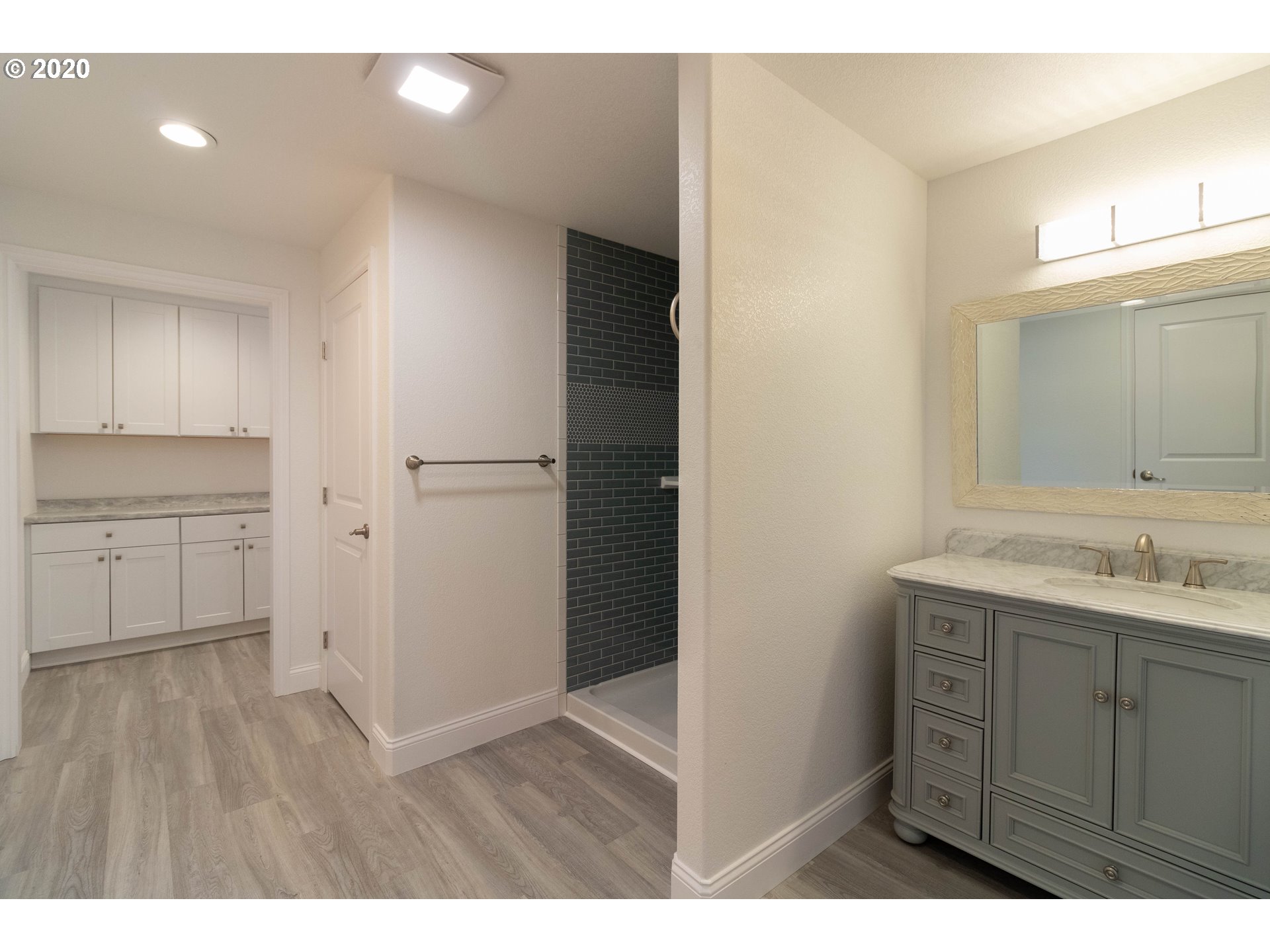3373 Melrose Road Roseburg, OR 97471 - Photo 15 of 32 a bathroom with a sink a mirror and a shower