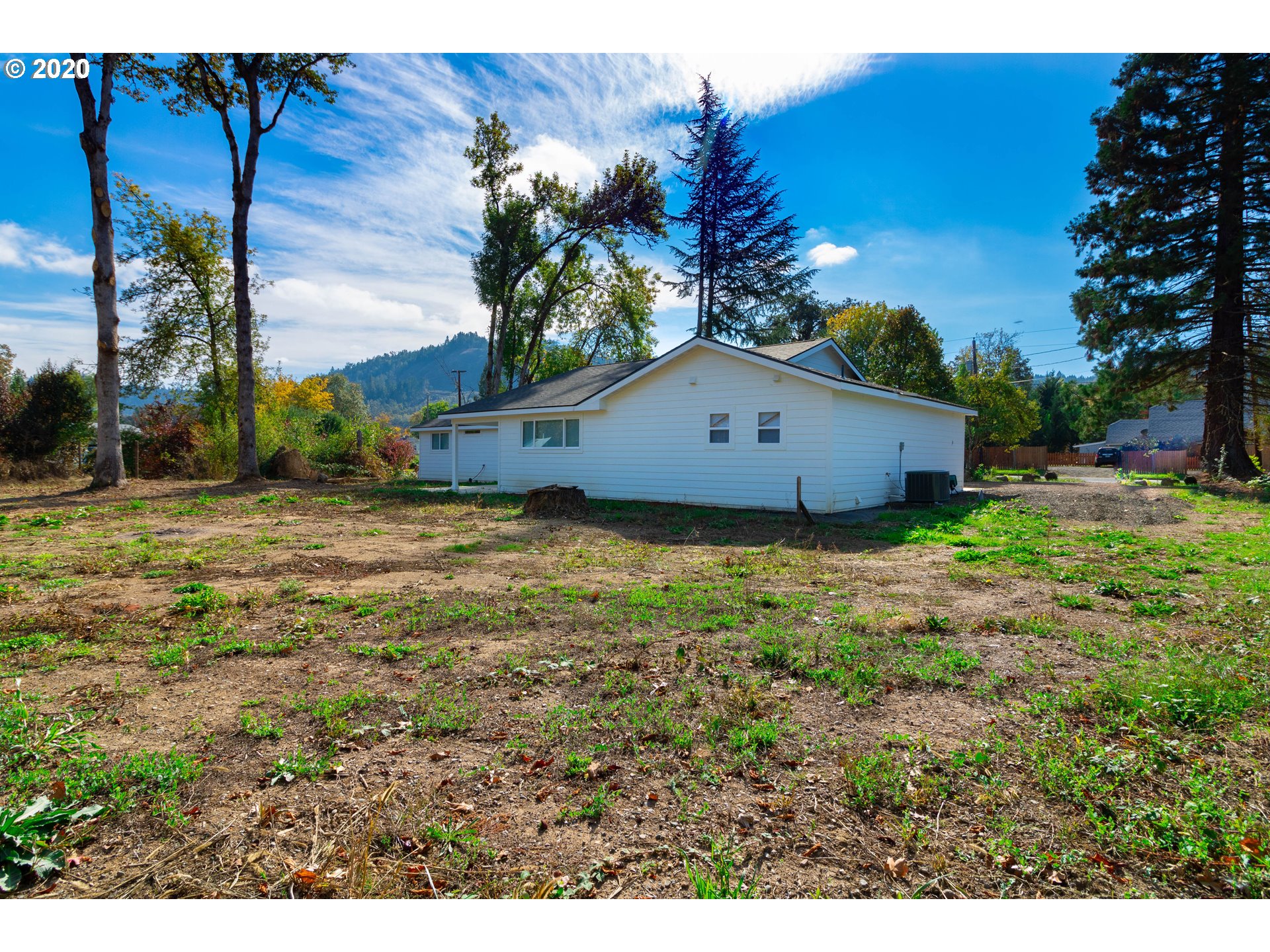 3373 Melrose Road Roseburg, OR 97471 - Photo 26 of 32 a view of a house with a yard