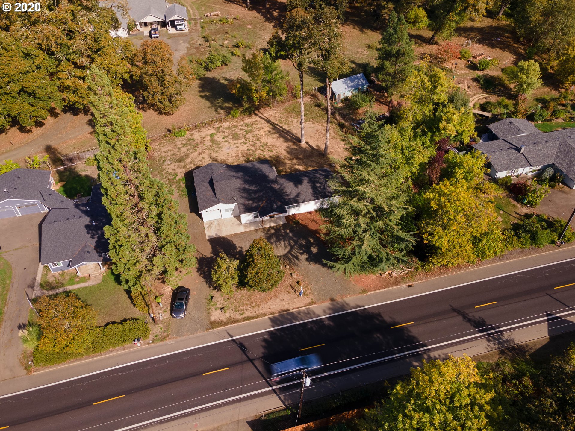 3373 Melrose Road Roseburg, OR 97471 - Photo 29 of 32 a view of a window with a tree