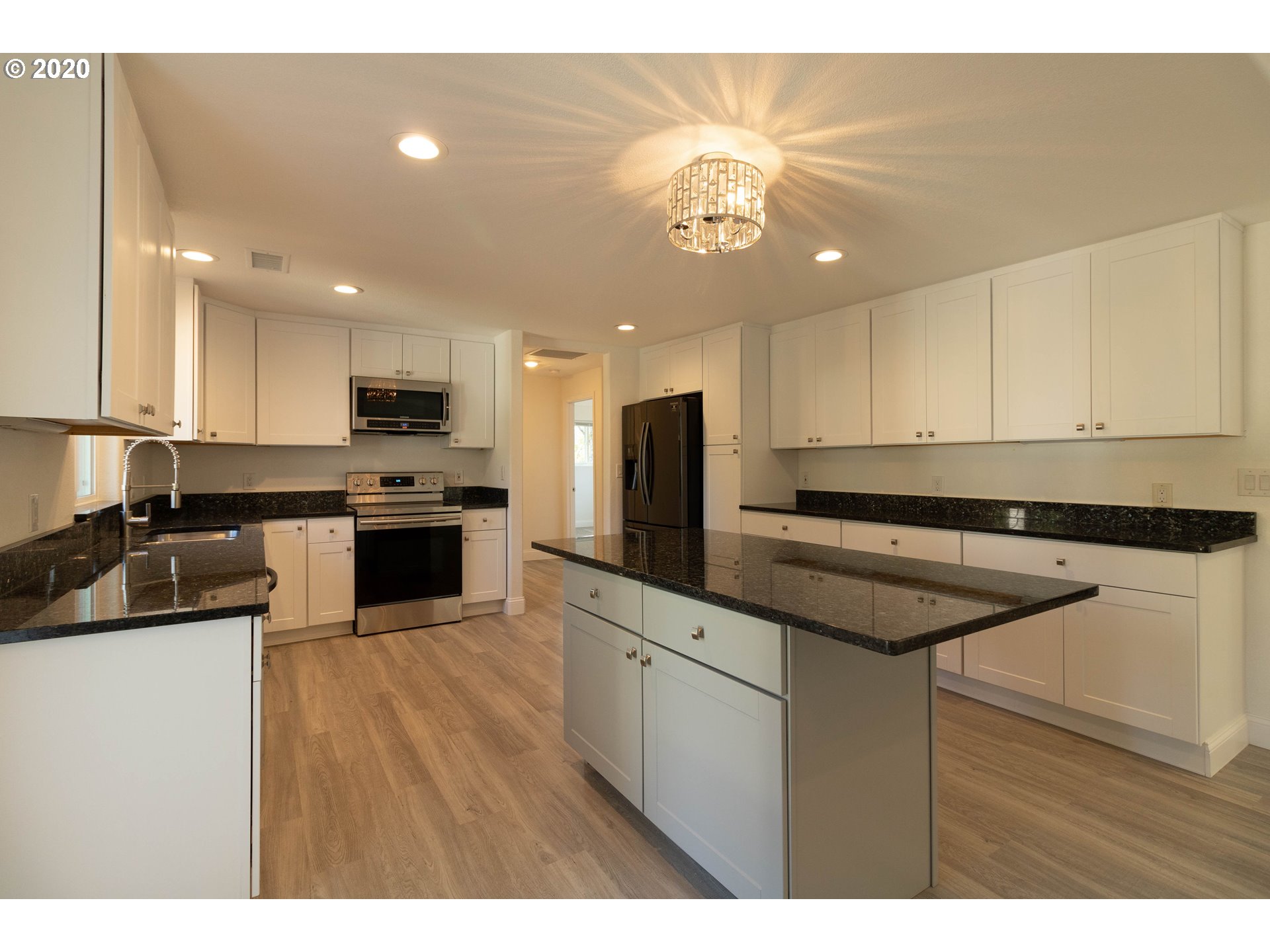 3373 Melrose Road Roseburg, OR 97471 - Photo 9 of 32 a kitchen with a sink stainless steel appliances and cabinets