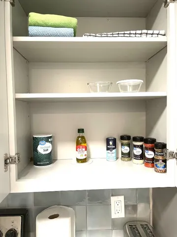 a bed sitting in a bedroom and a wooden floor