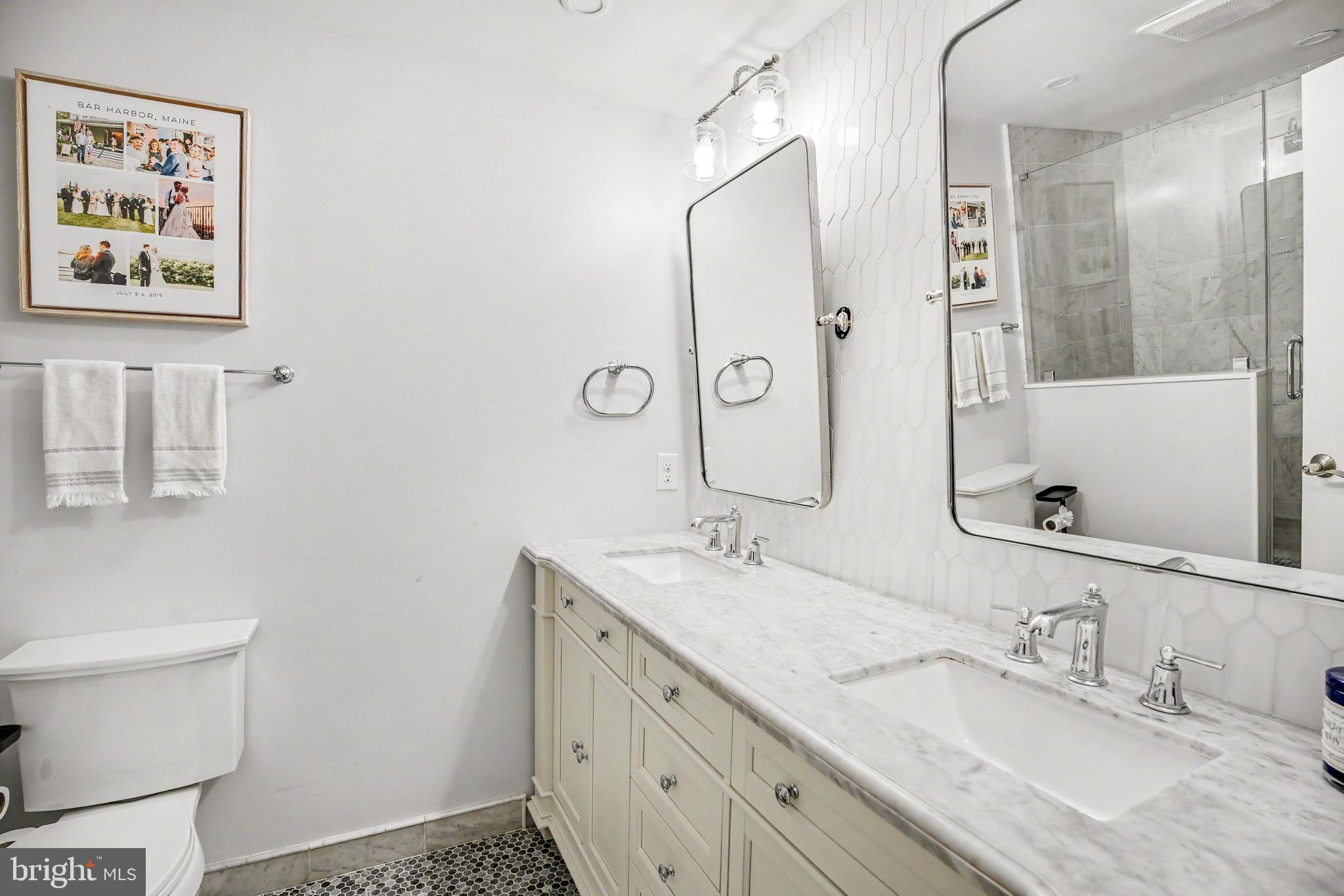 235 Hopkins Road Haddonfield, NJ 08033 - Photo 29 of 47 a bathroom with a granite countertop sink mirror vanity and toilet