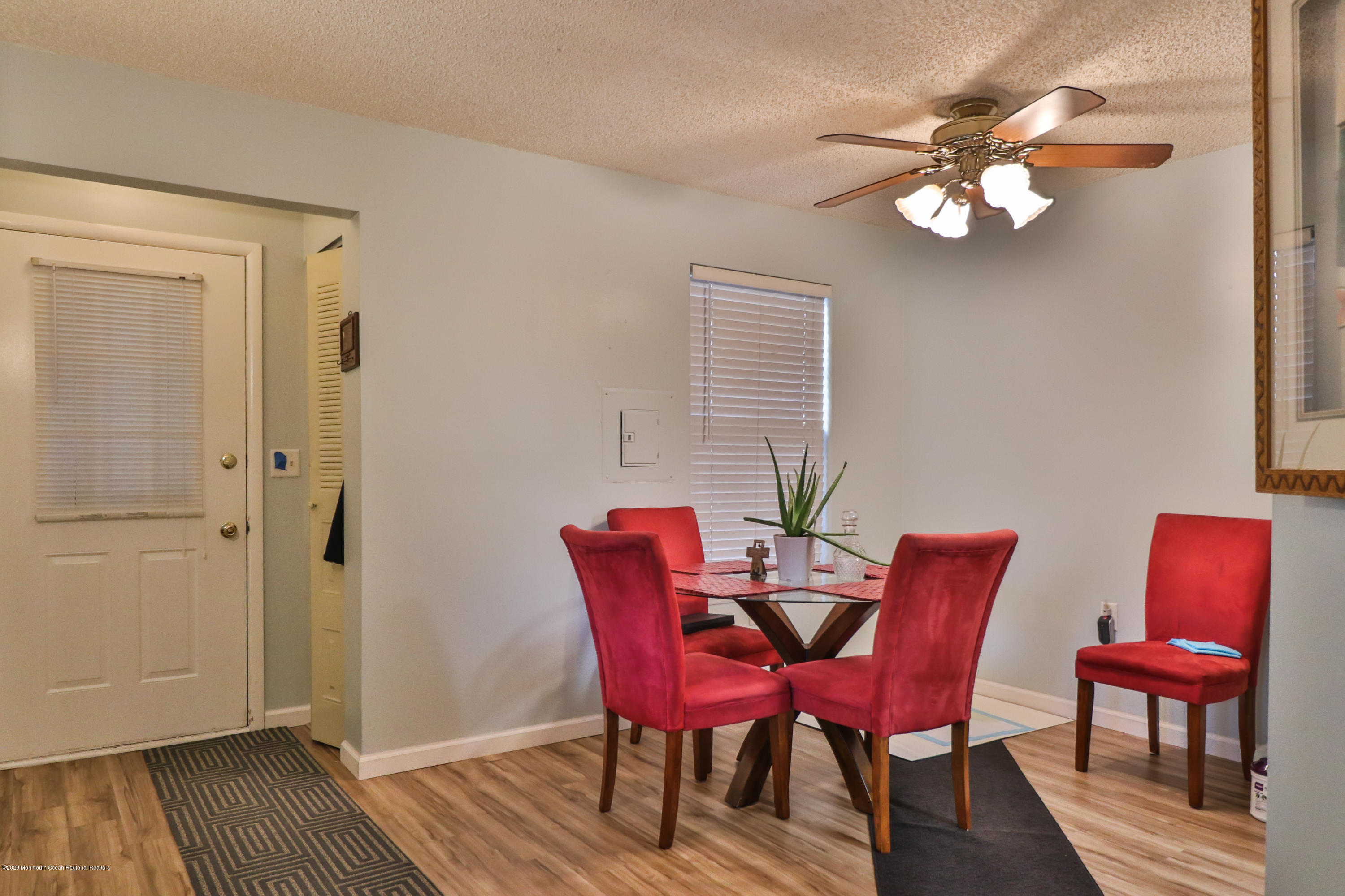 704 Violet Lane Jackson, NJ 08527 - Photo 2 of 20 a view of a dining room with furniture and wooden floor