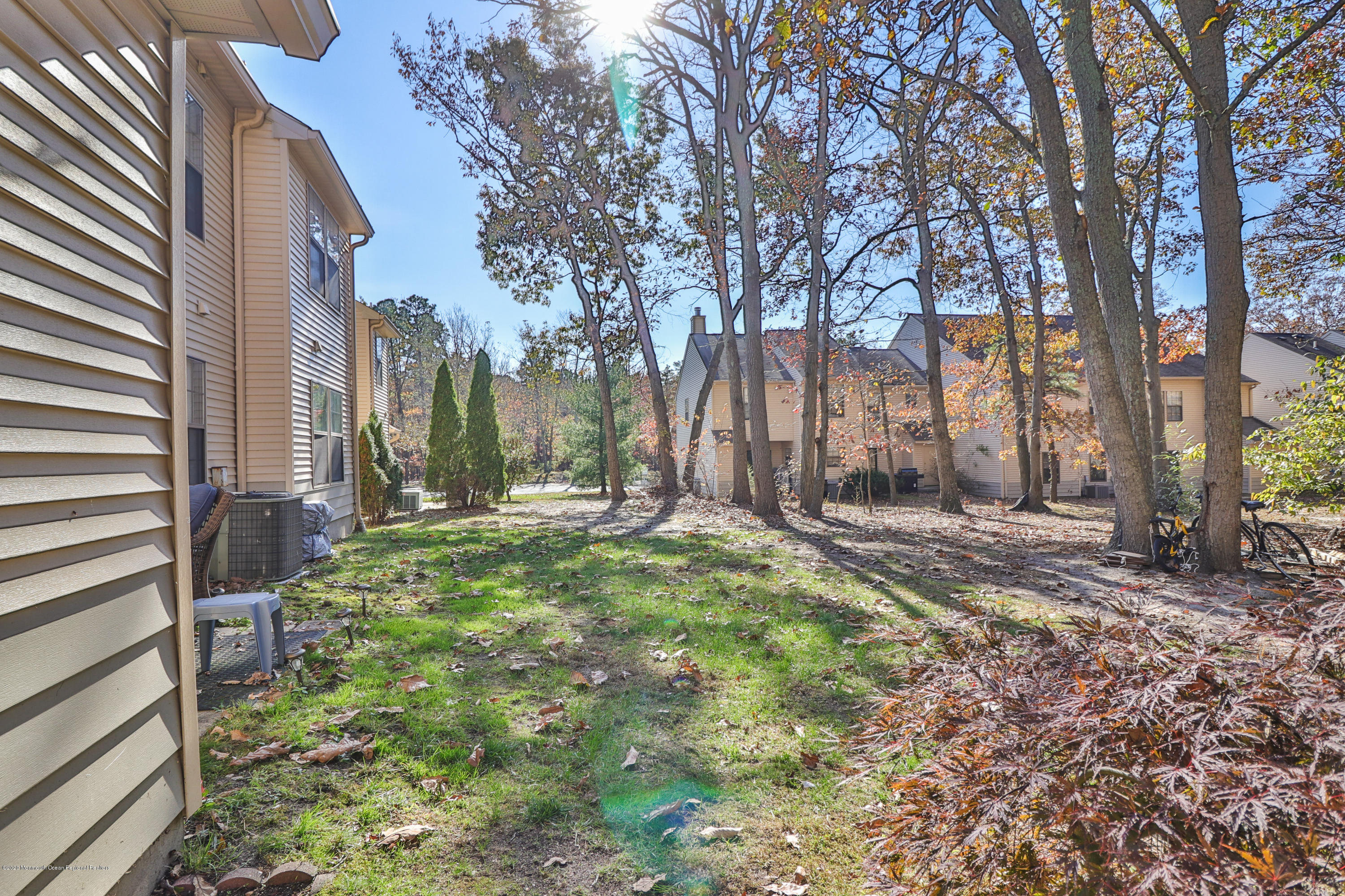 704 Violet Lane Jackson, NJ 08527 - Photo 12 of 20 a backyard of a house with lots of green space