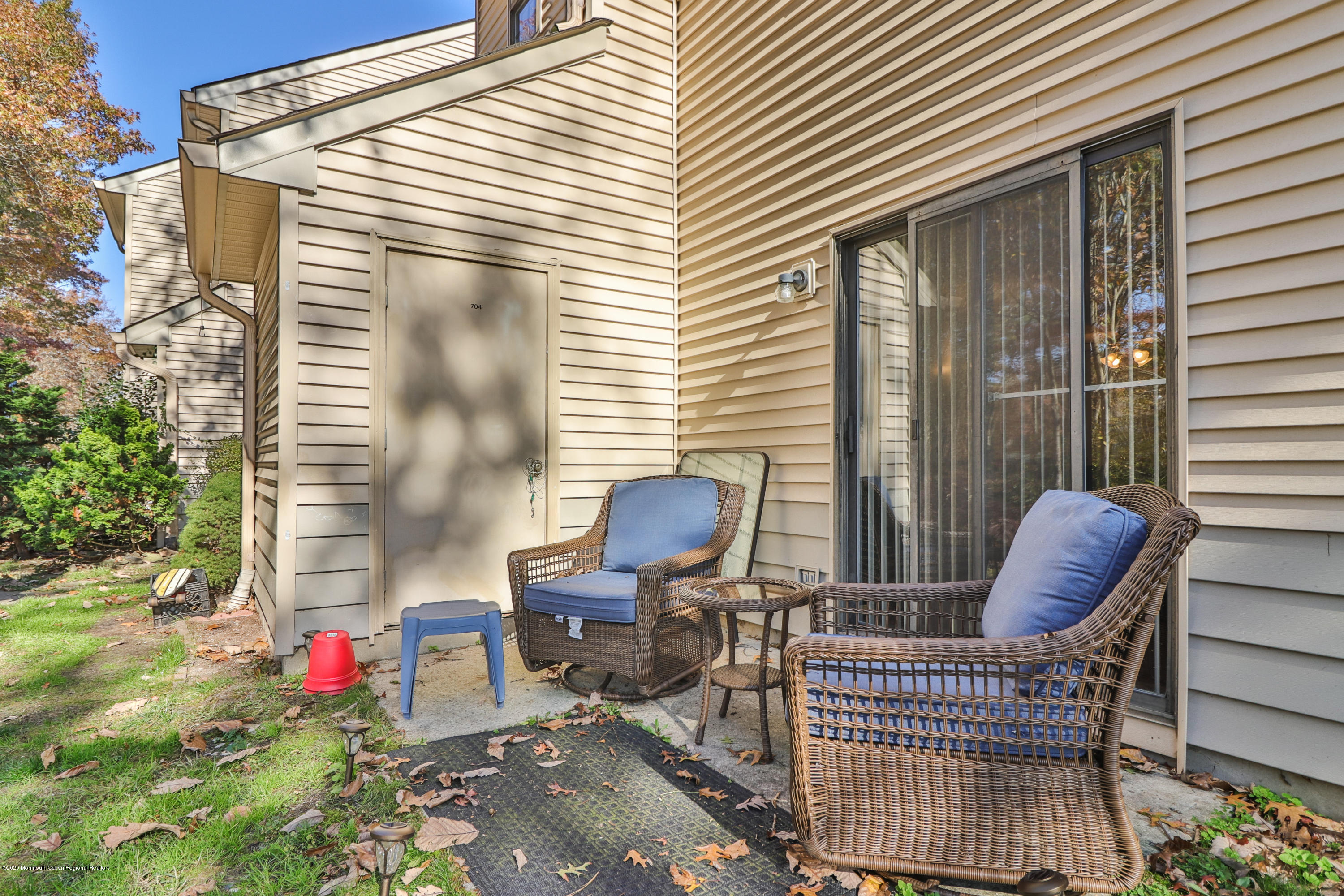 704 Violet Lane Jackson, NJ 08527 - Photo 14 of 20 a view of a chair and table in the balcony