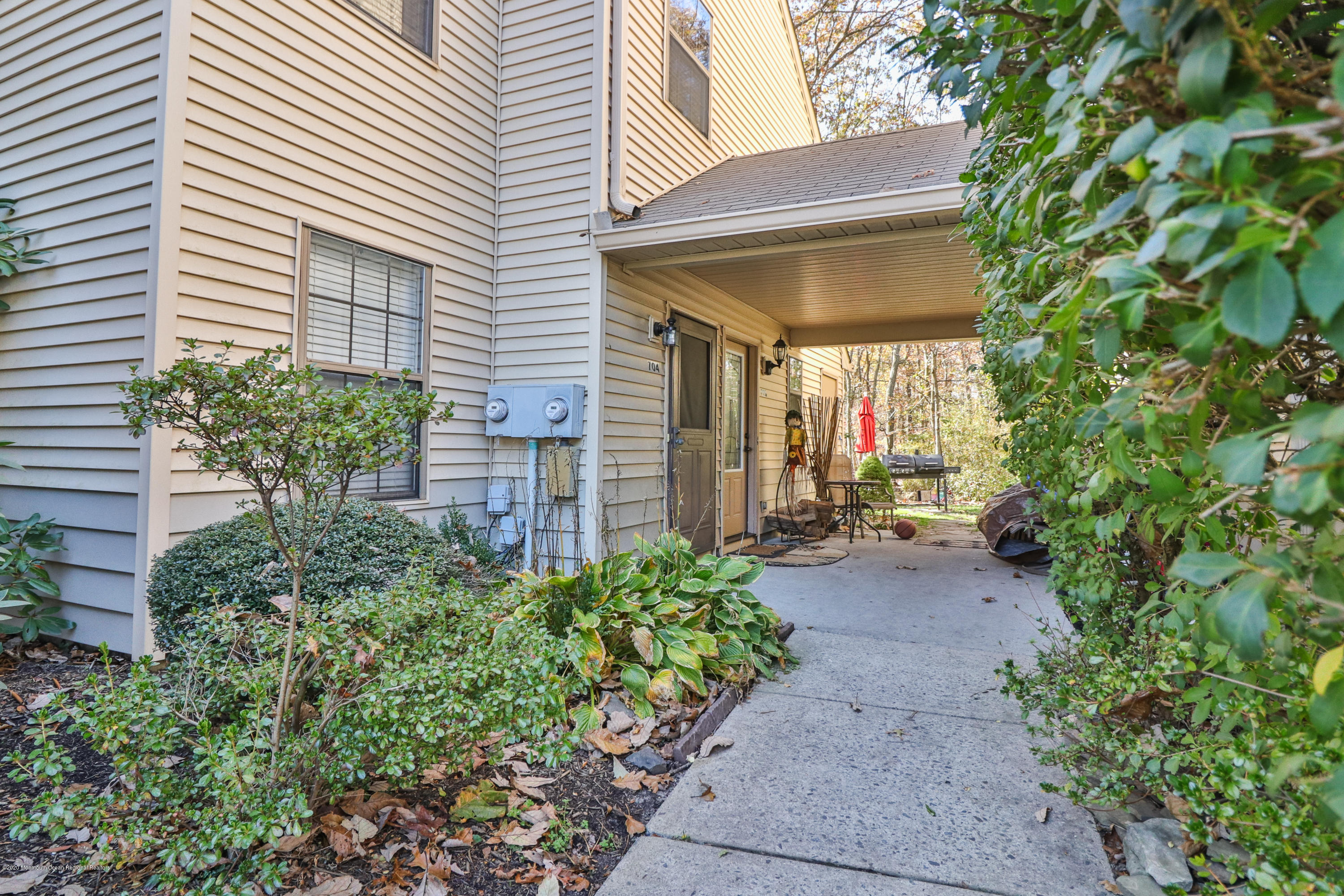 704 Violet Lane Jackson, NJ 08527 - Photo 17 of 20 a view of a backyard with potted plants