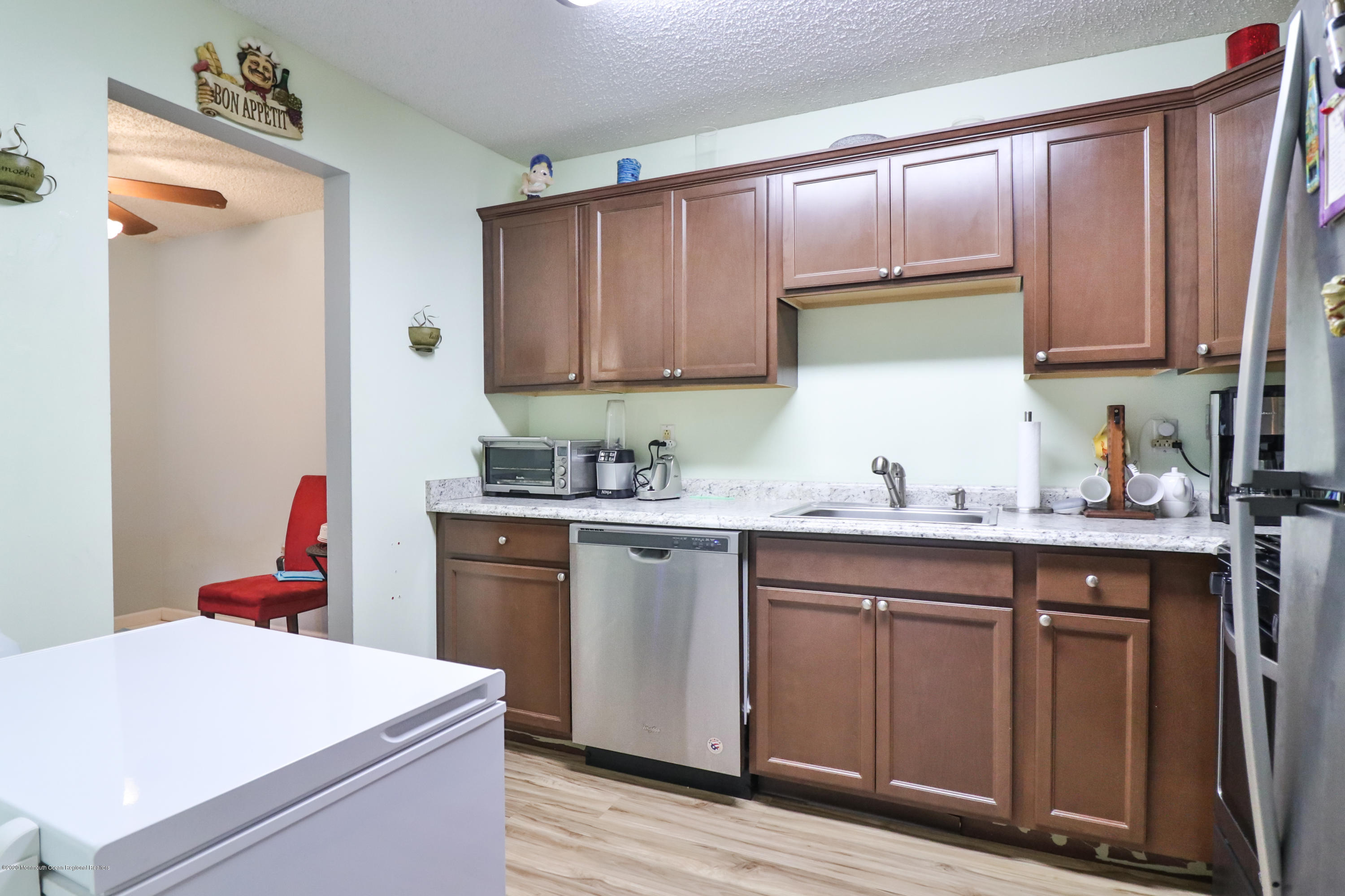 704 Violet Lane Jackson, NJ 08527 - Photo 6 of 20 a kitchen with a sink a stove and cabinets