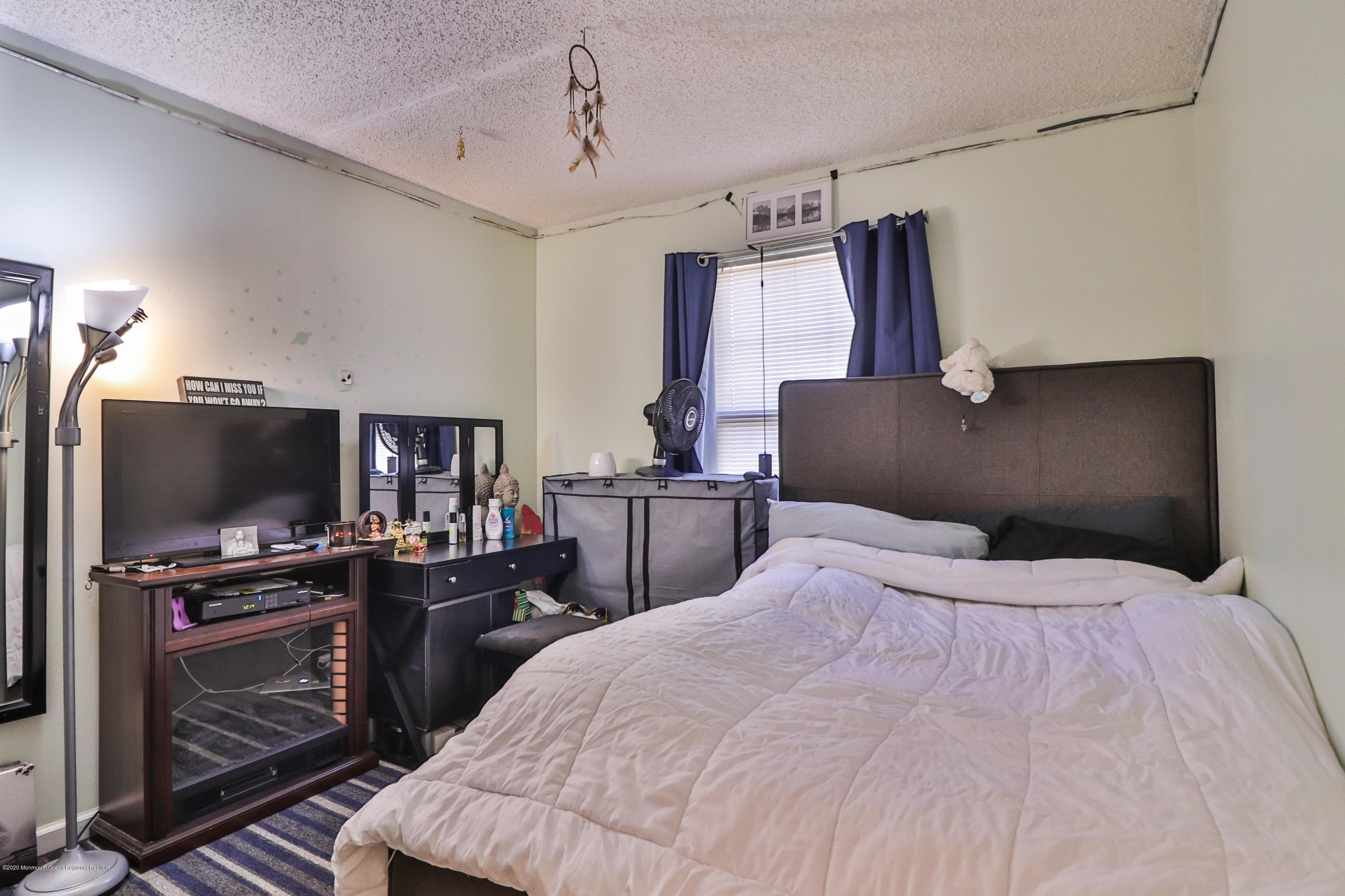 704 Violet Lane Jackson, NJ 08527 - Photo 7 of 20 a bedroom with a bed and a flat screen tv