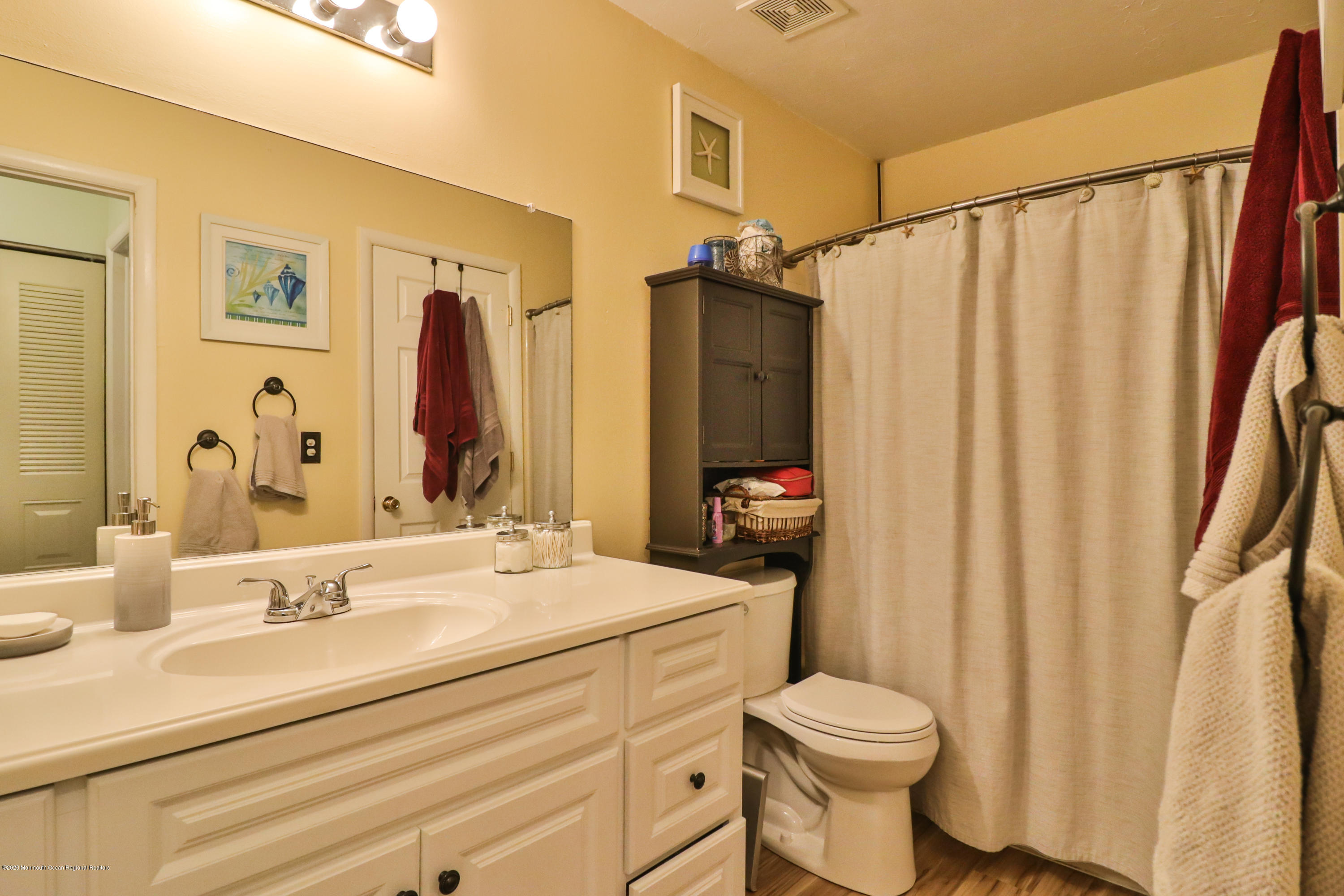 704 Violet Lane Jackson, NJ 08527 - Photo 8 of 20 a bathroom with a sink toilet and shower