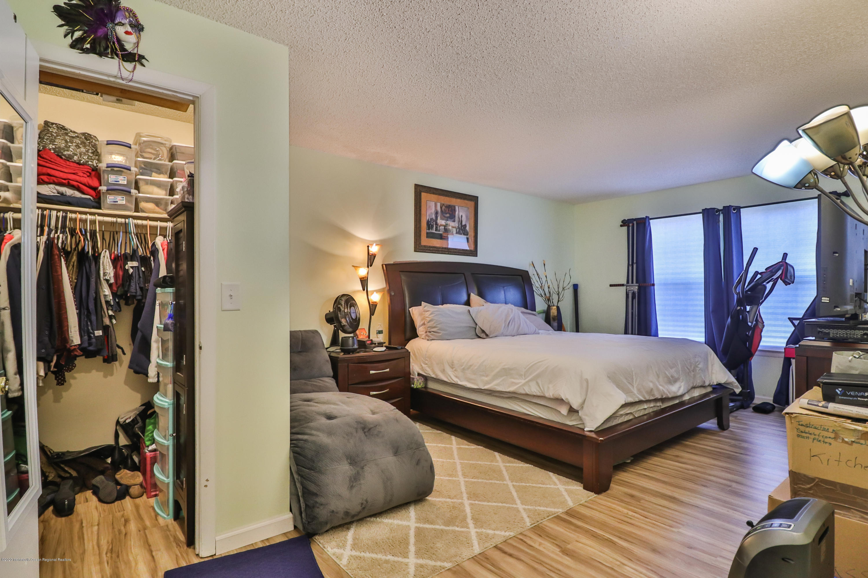 704 Violet Lane Jackson, NJ 08527 - Photo 9 of 20 a bedroom with a bed and a mirror