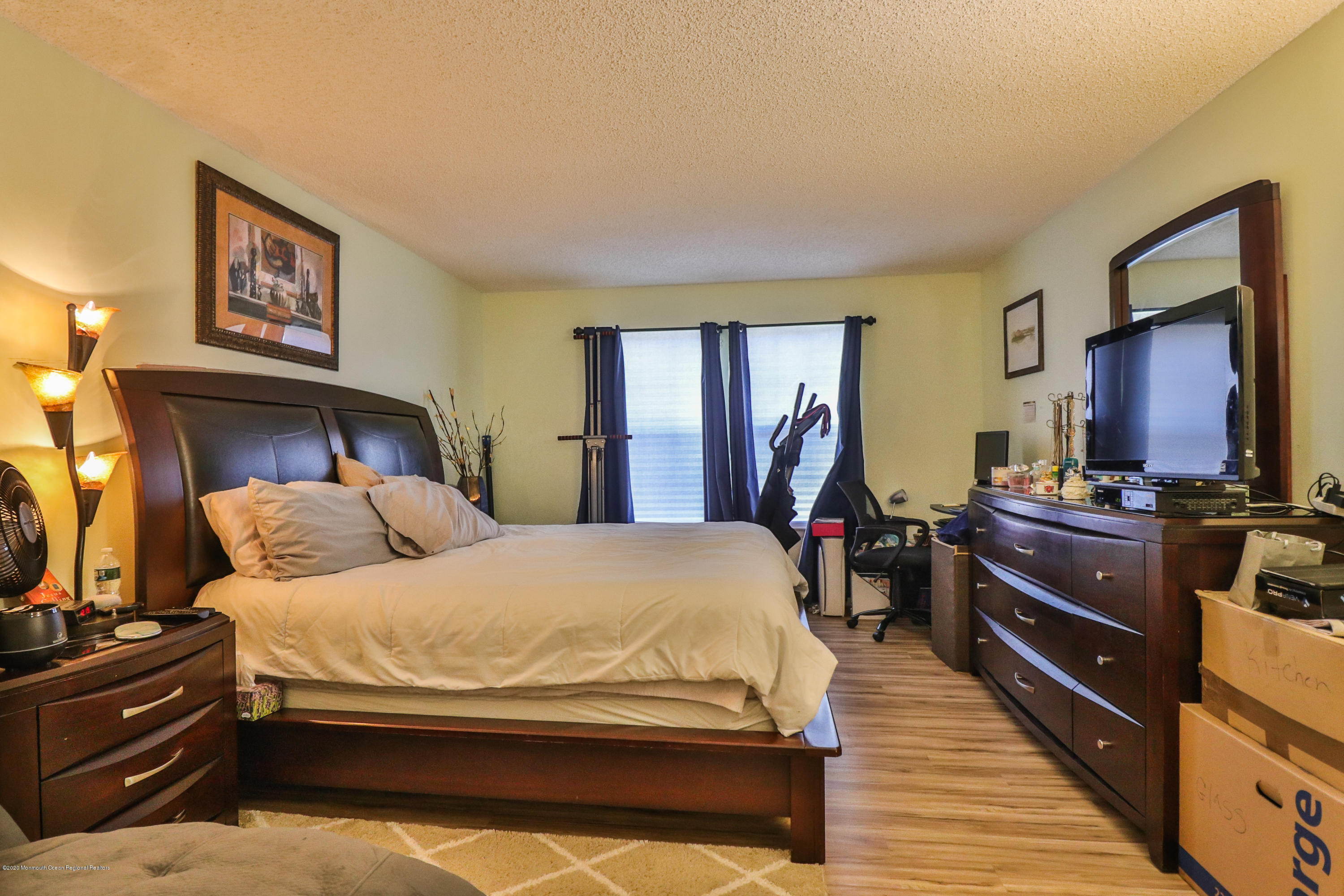 704 Violet Lane Jackson, NJ 08527 - Photo 10 of 20 a bedroom with a bed and a dresser