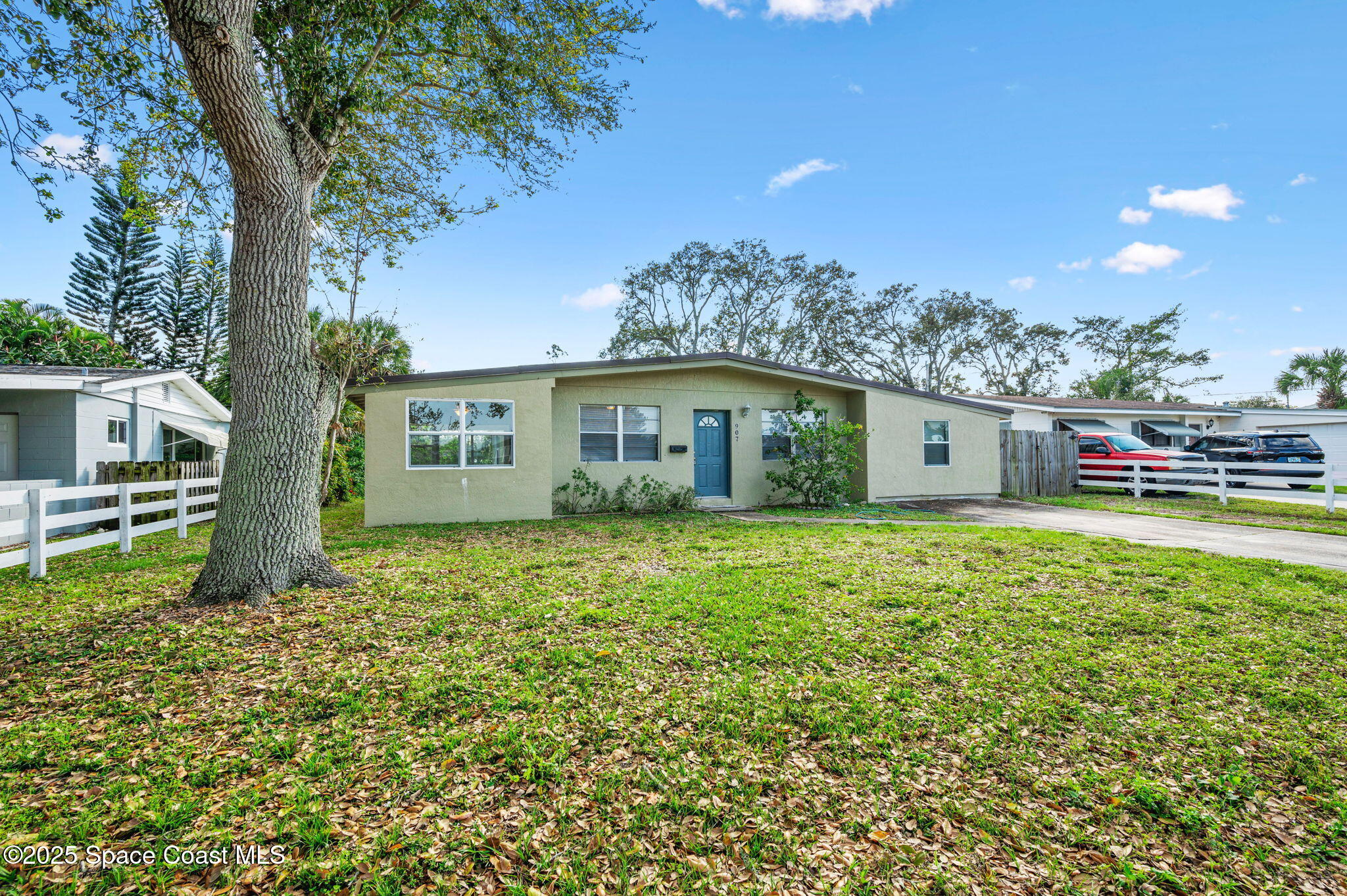 a backyard of a house with lots of green space