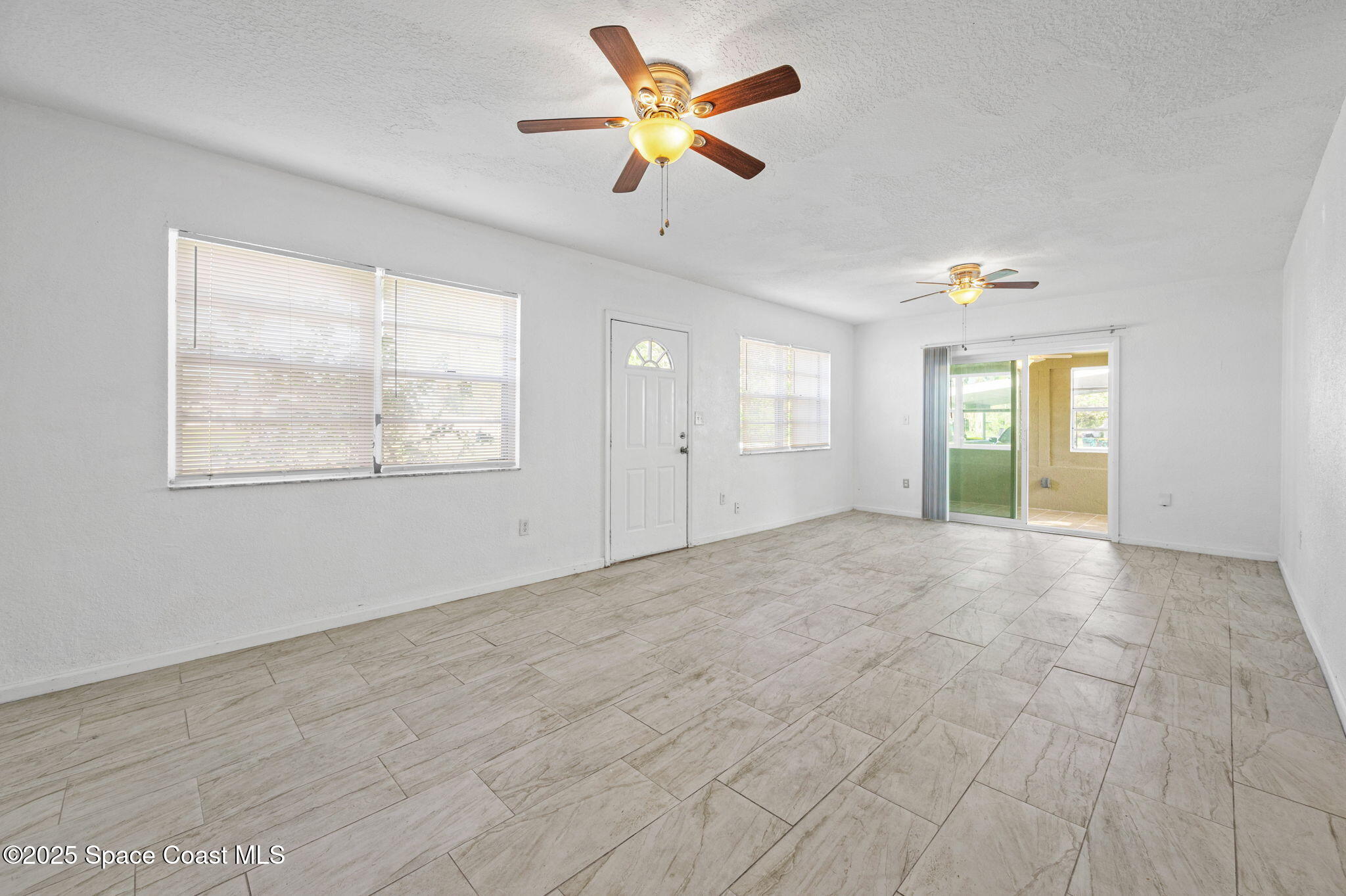 907 Espanola Way Melbourne, FL 32901 - Photo 16 of 31 a view of an empty room with a window