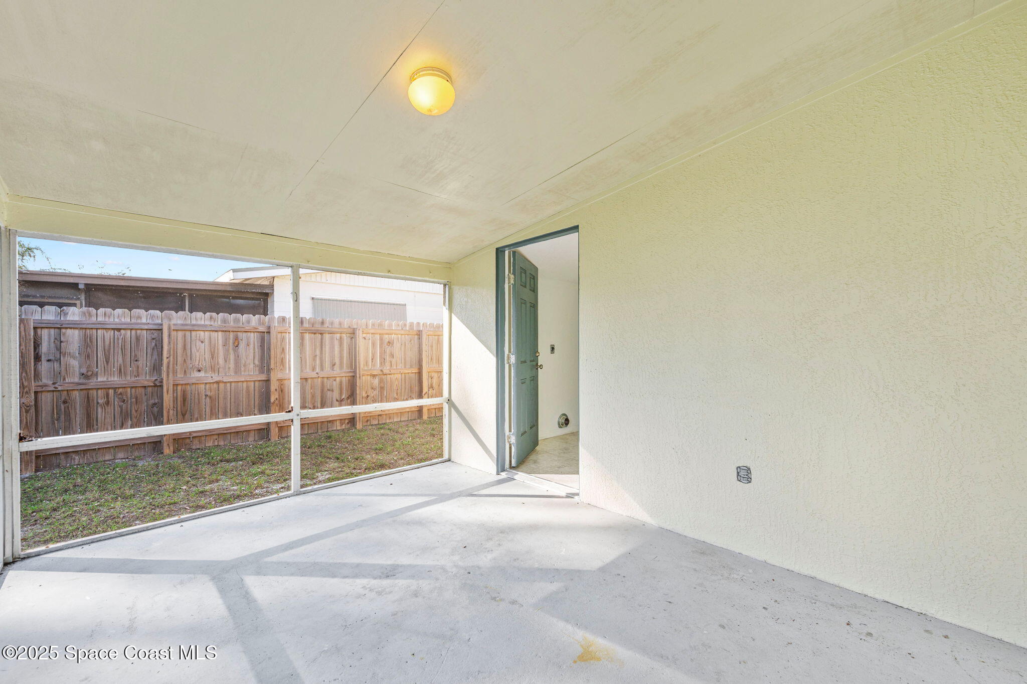 907 Espanola Way Melbourne, FL 32901 - Photo 21 of 31 a view of a room with sliding glass door