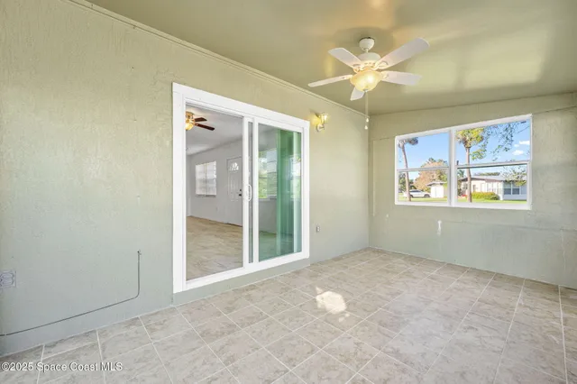 a view of a room with sliding glass door