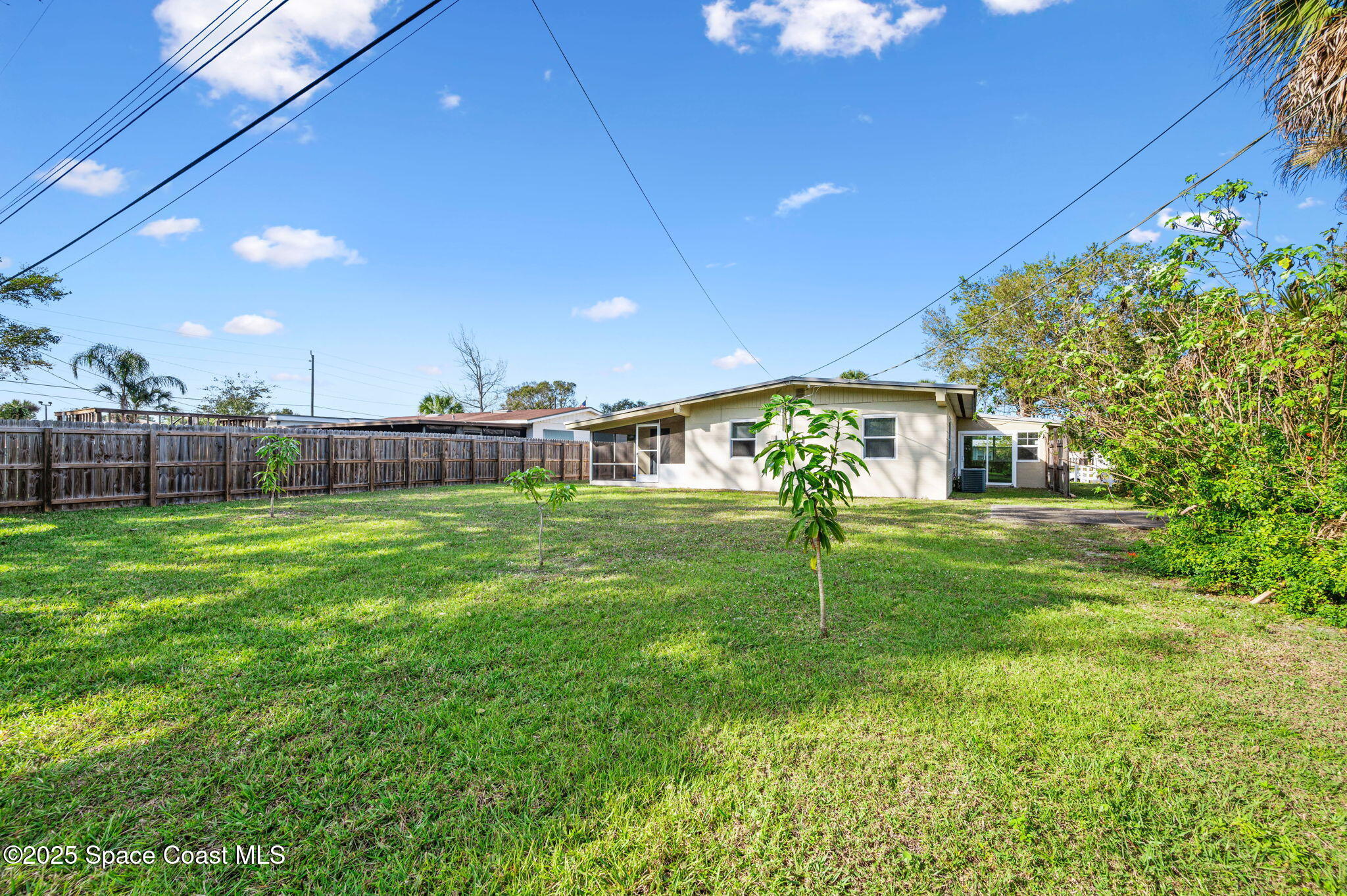 907 Espanola Way Melbourne, FL 32901 - Photo 25 of 31 a view of a house with a backyard