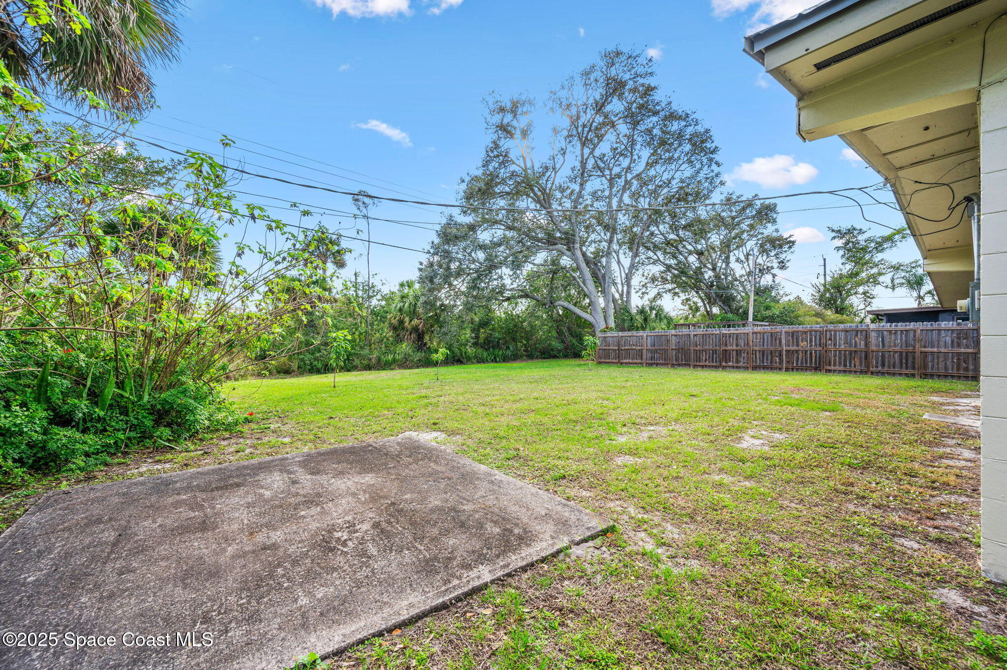 907 Espanola Way Melbourne, FL 32901 - Photo 26 of 31 a view of a yard with a tree