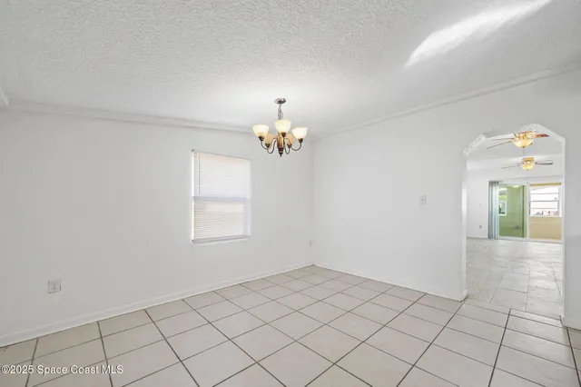 a bathroom with a granite countertop sink a toilet a mirror a bathtub and shower