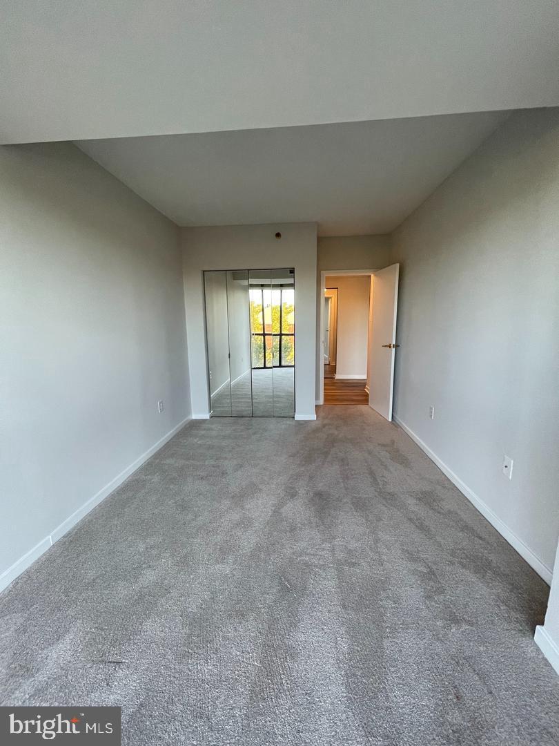 1530 Key Boulevard, Unit 326 Arlington, VA 22209 - Photo 17 of 47 an empty room with windows