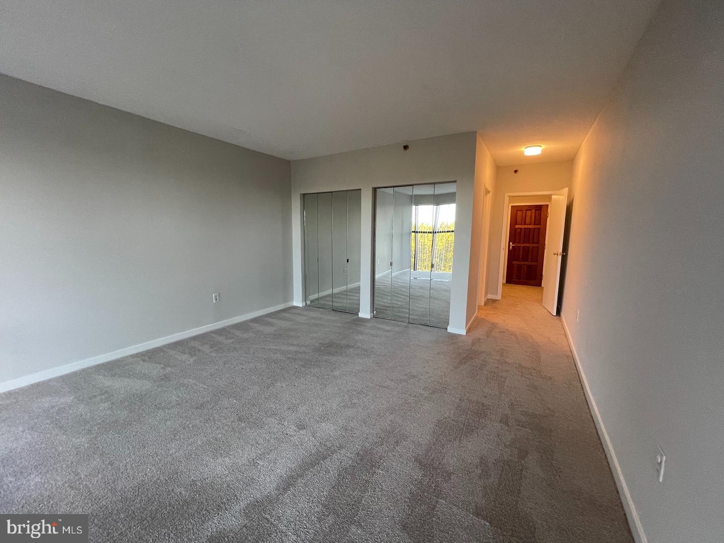 1530 Key Boulevard, Unit 326 Arlington, VA 22209 - Photo 27 of 47 a view of a big room with a chandelier fan