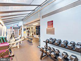 1530 Key Boulevard, Unit 326 Arlington, VA 22209 - Photo 43 of 47 a room with lots of white furniture and closet