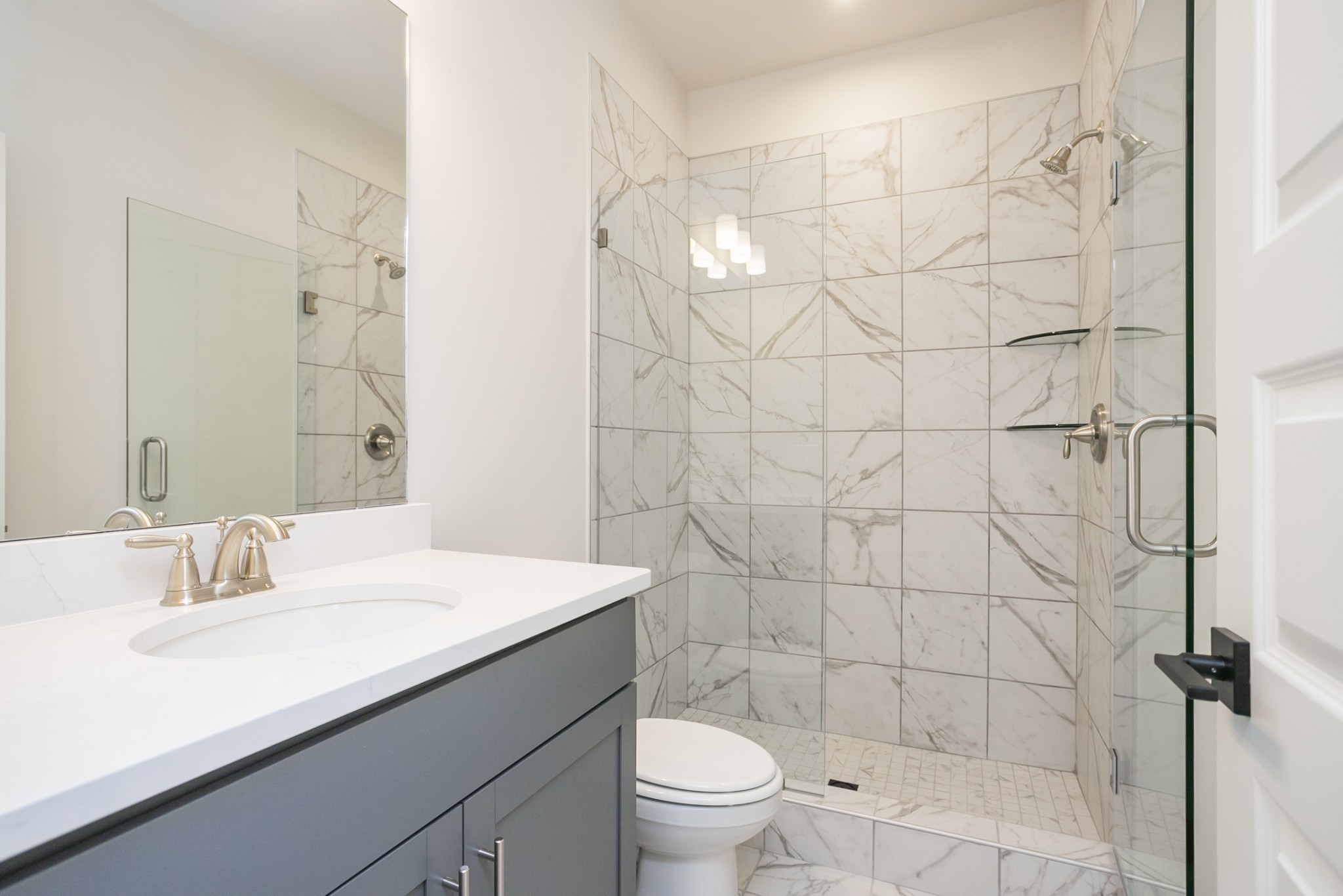 940 Pleasant Ridge Run Mount Juliet, TN 37122 - Photo 21 of 32 a bathroom with a sink a toilet and shower