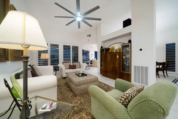 a living room with furniture and a large window