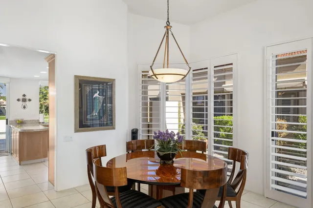 a dining room with furniture and window