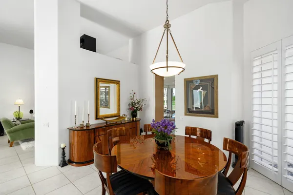 a dining room with furniture and window