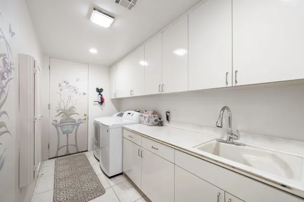 a kitchen with a sink and cabinets