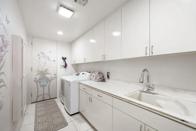 a kitchen with a sink and cabinets